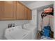 Convenient laundry room with washer, dryer, and extra storage cabinets at 3309 Jamaica Princess Pl # 3, North Las Vegas, NV 89084