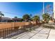 Private backyard patio with wrought iron fencing and desert landscaping at 3367 Vema Dr, Las Vegas, NV 89121