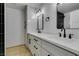 Modern bathroom with double vanity, black and white tile, and updated fixtures at 3367 Vema Dr, Las Vegas, NV 89121