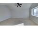 Bright and airy bedroom featuring a ceiling fan and large window at 3367 Vema Dr, Las Vegas, NV 89121