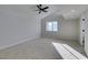 Well-lit bedroom with vaulted ceiling, carpet, and ceiling fan at 3367 Vema Dr, Las Vegas, NV 89121