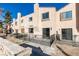 Rear view of a two-story stucco building with private patios at 3367 Vema Dr, Las Vegas, NV 89121