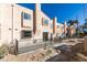 Side view of a light beige stucco building with a fenced patio area at 3367 Vema Dr, Las Vegas, NV 89121