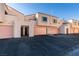 Front view of a two-story building with attached garages and individual entrances at 3367 Vema Dr, Las Vegas, NV 89121