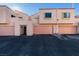 Front view of a two-story building with attached garages and individual entrances at 3367 Vema Dr, Las Vegas, NV 89121