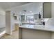 Modern kitchen featuring white shaker cabinets, stainless steel appliances, and quartz countertops at 3367 Vema Dr, Las Vegas, NV 89121