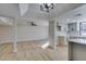 Open concept kitchen with white cabinets and quartz countertops at 3367 Vema Dr, Las Vegas, NV 89121