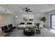 Living room features a sectional sofa and a large ceiling fan at 3367 Vema Dr, Las Vegas, NV 89121