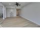 Living room with wood-look floors, built-in wet bar, and half bathroom at 3367 Vema Dr, Las Vegas, NV 89121