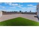 Large backyard with gravel and a small patch of artificial turf at 3446 Cactus Springs Dr, Las Vegas, NV 89115