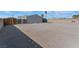 Large gravel backyard with wood fence and gate at 3446 Cactus Springs Dr, Las Vegas, NV 89115