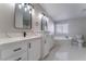 Bathroom boasts double vanity, quartz countertop and a soaking tub at 3446 Cactus Springs Dr, Las Vegas, NV 89115