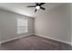 Bedroom with ceiling fan and window at 3446 Cactus Springs Dr, Las Vegas, NV 89115