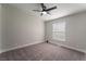 Spacious bedroom featuring a ceiling fan and large window at 3446 Cactus Springs Dr, Las Vegas, NV 89115