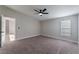 Spacious bedroom with ceiling fan and carpet at 3446 Cactus Springs Dr, Las Vegas, NV 89115