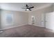 Primary bedroom with ceiling fan and carpet at 3446 Cactus Springs Dr, Las Vegas, NV 89115