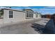 Modern single-story home with gray siding and a large concrete driveway at 3446 Cactus Springs Dr, Las Vegas, NV 89115