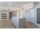 Bright kitchen with white cabinets, quartz countertops, and an island at 3446 Cactus Springs Dr, Las Vegas, NV 89115