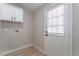 Laundry room with white cabinets and vinyl flooring at 3446 Cactus Springs Dr, Las Vegas, NV 89115