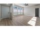 Spacious living room with vinyl flooring and large windows at 3446 Cactus Springs Dr, Las Vegas, NV 89115