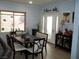 Bright dining room with a table for six and decorative accents at 3925 Vulcan St, Las Vegas, NV 89122