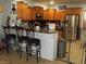 Kitchen with wood cabinets, granite counters and island at 3925 Vulcan St, Las Vegas, NV 89122