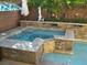 Inviting spa and pool with stone accents at 3925 Vulcan St, Las Vegas, NV 89122