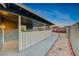 Pathway beside a white fence leading to the backyard at 402 Bell Ave, Henderson, NV 89015