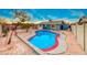 Inviting backyard with a sparkling blue pool and a spacious patio area at 402 Bell Ave, Henderson, NV 89015