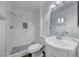 Updated bathroom with white vanity and marble shower at 402 Bell Ave, Henderson, NV 89015