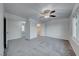 Bright bedroom with ceiling fan and gray carpeting at 402 Bell Ave, Henderson, NV 89015