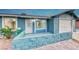 Newly renovated single-story home with a clean, light blue exterior and a spacious yard at 402 Bell Ave, Henderson, NV 89015