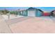 Newly renovated single-story home with a clean, light blue exterior and a spacious yard at 402 Bell Ave, Henderson, NV 89015