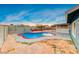 Kidney-shaped swimming pool with red tile border at 402 Bell Ave, Henderson, NV 89015