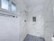 Clean shower with marble tile and mosaic floor at 402 Bell Ave, Henderson, NV 89015