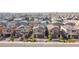 Aerial perspective of houses featuring solar panels and a landscaped street at 4138 Bayley Skye Ave, Las Vegas, NV 89141