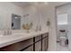 Modern bathroom with double vanity and separate toilet area at 4138 Bayley Skye Ave, Las Vegas, NV 89141