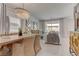 Bright dining room with large windows and modern chandelier at 4138 Bayley Skye Ave, Las Vegas, NV 89141