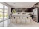 Modern kitchen with dark cabinets and large island at 4138 Bayley Skye Ave, Las Vegas, NV 89141