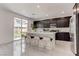 Modern kitchen with dark cabinets and large island at 4138 Bayley Skye Ave, Las Vegas, NV 89141