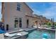 Stunning pool with spacious patio and lounge chairs at 4138 Bayley Skye Ave, Las Vegas, NV 89141