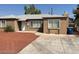 Ranch style home with a red rock front yard and driveway at 431 Bedford Rd, Las Vegas, NV 89107