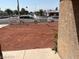 Landscaped front yard with red rock and a white picket fence at 431 Bedford Rd, Las Vegas, NV 89107