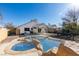 Large backyard with a swimming pool and patio area at 4421 Rodman Dr, Las Vegas, NV 89130