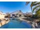 Inviting backyard oasis featuring a sparkling pool, spacious patio, and covered seating area at 4421 Rodman Dr, Las Vegas, NV 89130