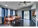 Bright dining room with hardwood floors and a large wooden table at 4421 Rodman Dr, Las Vegas, NV 89130