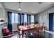 Formal dining room with a large table and dark hardwood floors at 4421 Rodman Dr, Las Vegas, NV 89130