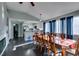 Bright dining room features a spacious table with seating for eight and hardwood floors at 4421 Rodman Dr, Las Vegas, NV 89130