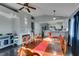 Spacious dining room with hardwood floors, a fireplace, and a view of the kitchen at 4421 Rodman Dr, Las Vegas, NV 89130