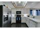 Kitchen with stainless steel appliances and white cabinets at 4421 Rodman Dr, Las Vegas, NV 89130